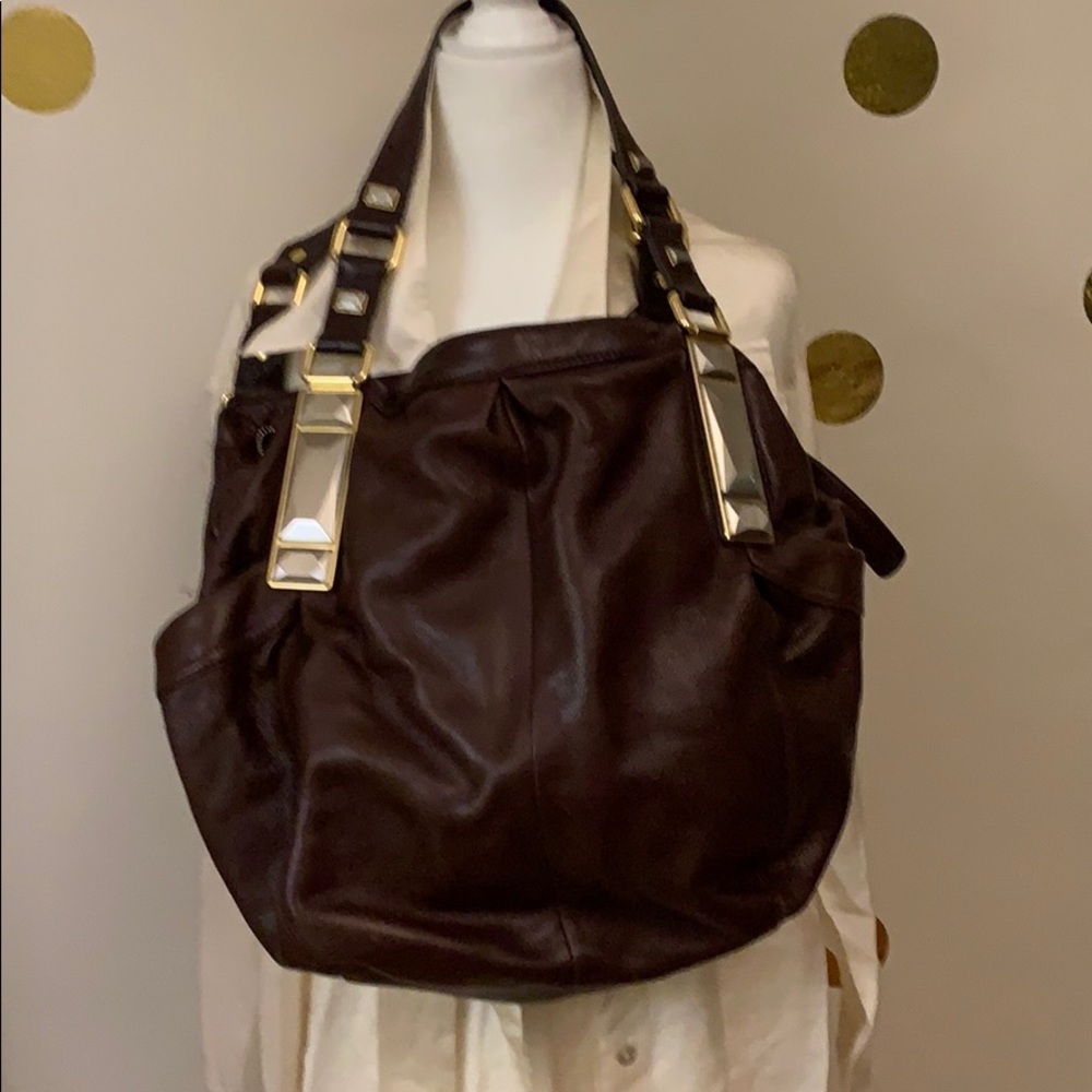 Burgundy leather bag with mixed metal hardware.